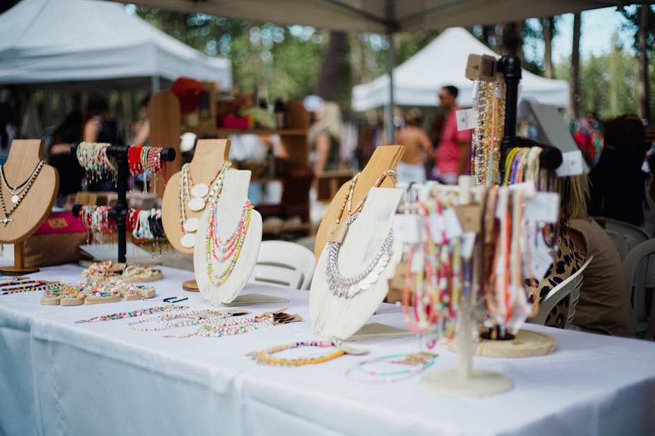 Vibrant handmade jewelry showcased at an outdoor market event.