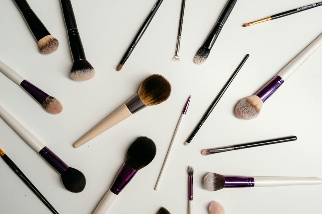 A stylish flat lay of various makeup brushes, perfect for beauty and cosmetic themes.